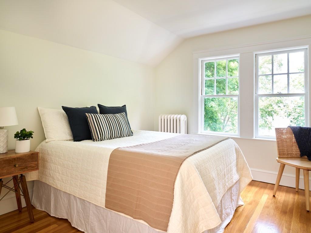 18 Bonad Road Arlington, MA 02476 - Photo 15 of 23 a bedroom with a bed and wooden floor