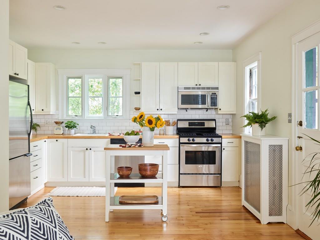 18 Bonad Road Arlington, MA 02476 - Photo 7 of 23 a kitchen with granite countertop a stove and a refrigerator