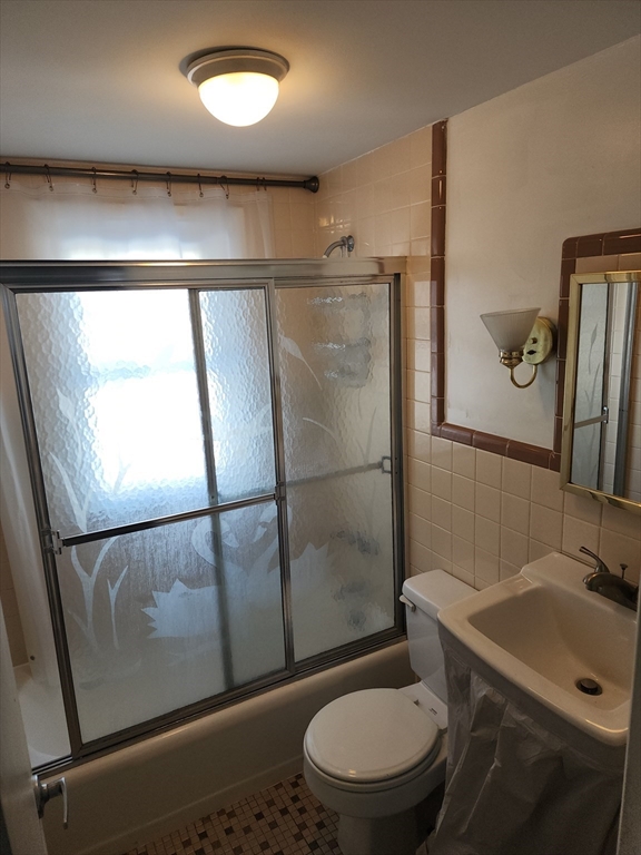 23 Brewster Road Weymouth, MA 02191 - Photo 11 of 21 a white toilet sitting next to a bathroom sink