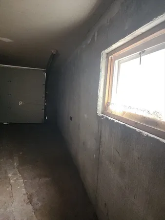 a view of a room that has a window in it