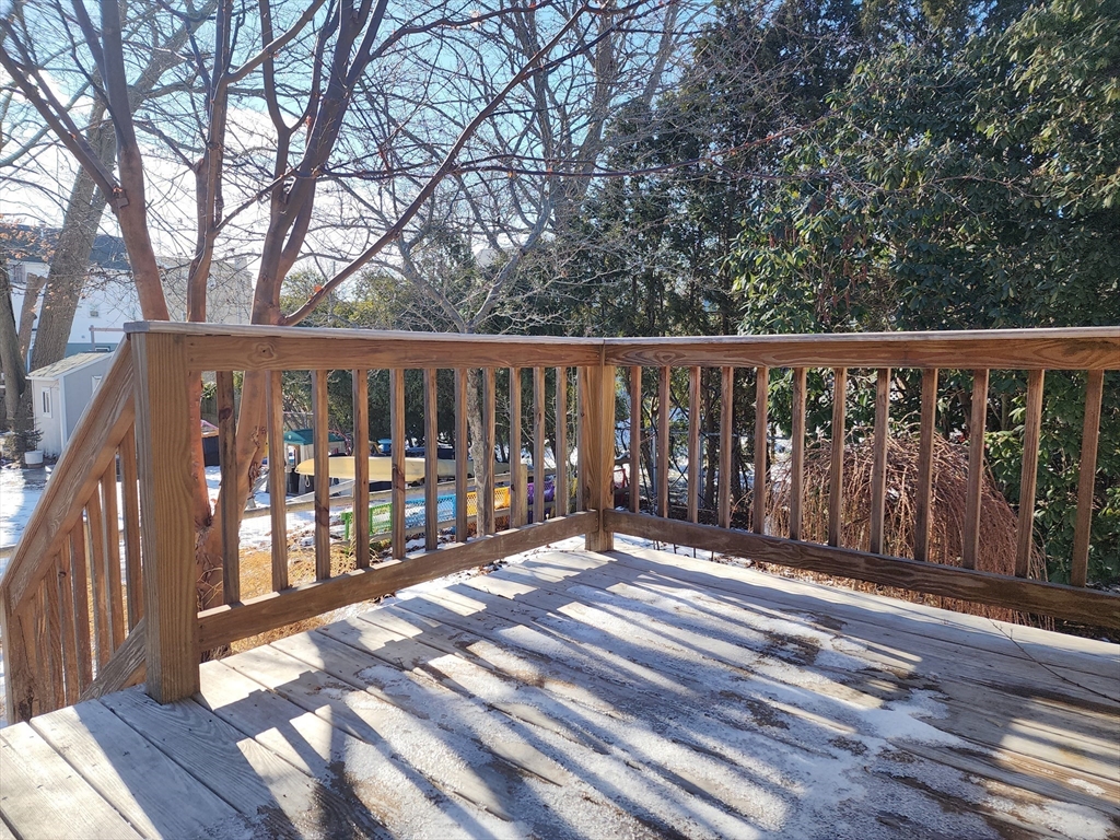 23 Brewster Road Weymouth, MA 02191 - Photo 4 of 21 a balcony with wooden floor