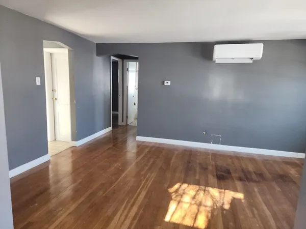 a view of an empty room and window