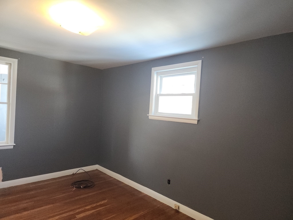23 Brewster Road Weymouth, MA 02191 - Photo 10 of 21 an empty room with a window