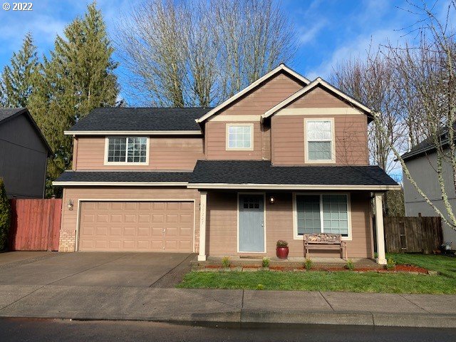 37227 Solso Road Sandy, OR 97055 - Photo 1 of 28 a front view of a house with a yard and garage