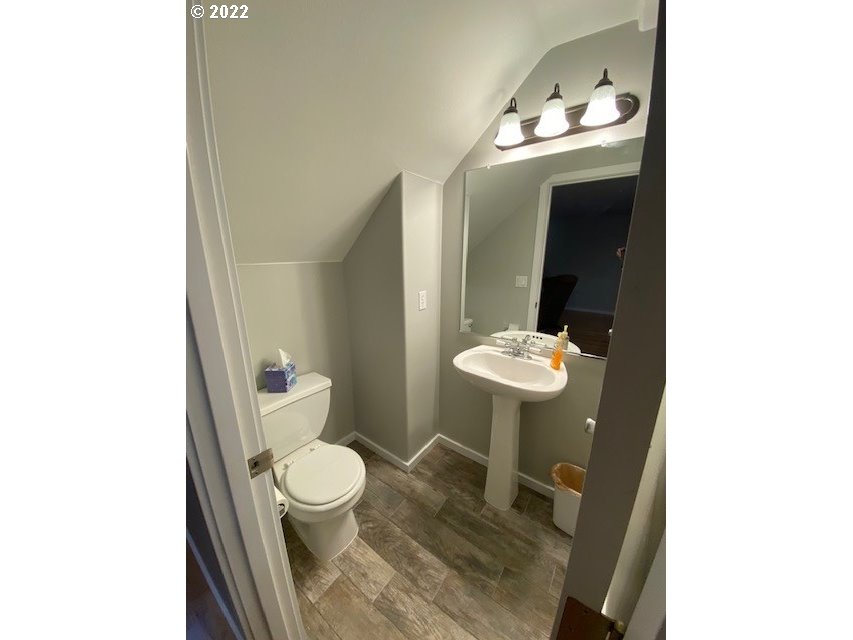 37227 Solso Road Sandy, OR 97055 - Photo 11 of 28 a bathroom with a toilet sink and mirror