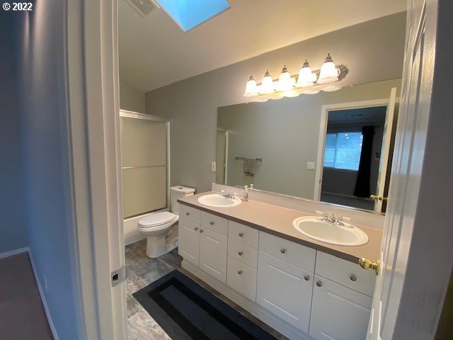 37227 Solso Road Sandy, OR 97055 - Photo 16 of 28 a bathroom with a double vanity sink and a mirror