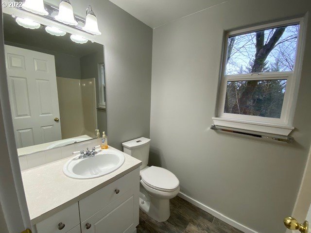 37227 Solso Road Sandy, OR 97055 - Photo 19 of 28 a bathroom with a toilet a sink and mirror