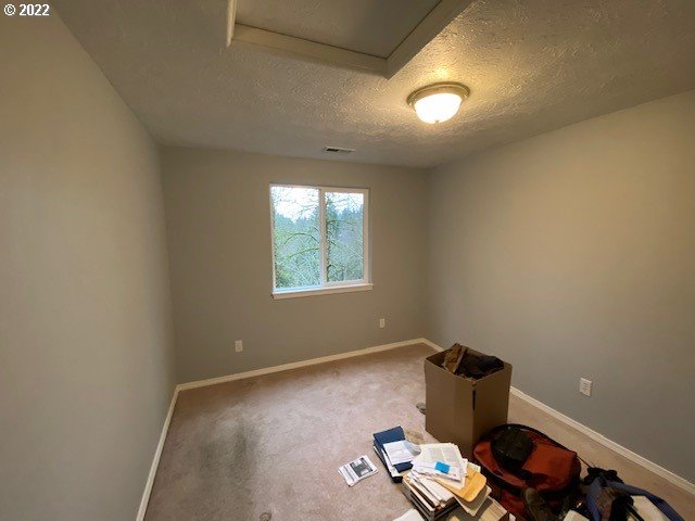 37227 Solso Road Sandy, OR 97055 - Photo 24 of 28 a room with a wooden floor and a window