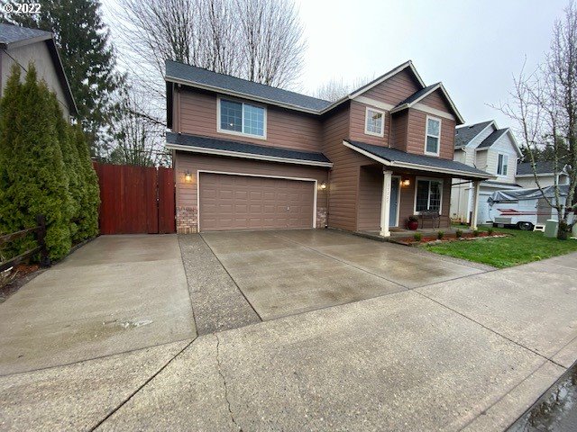 37227 Solso Road Sandy, OR 97055 - Photo 28 of 28 a front view of a house with a yard and garage