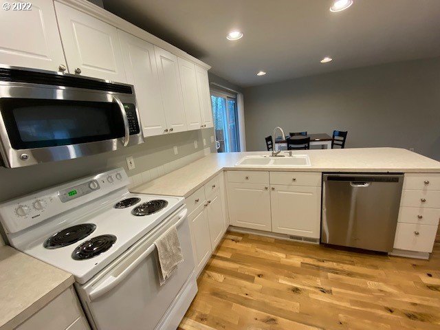 37227 Solso Road Sandy, OR 97055 - Photo 3 of 28 a kitchen with a stove a sink and a microwave