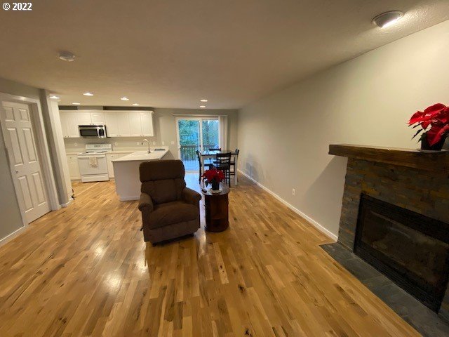 37227 Solso Road Sandy, OR 97055 - Photo 8 of 28 a living room with furniture and a fireplace