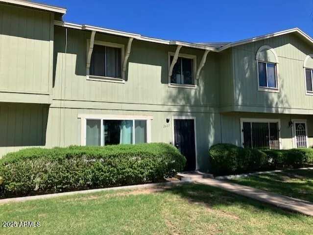 a front view of a house with a yard