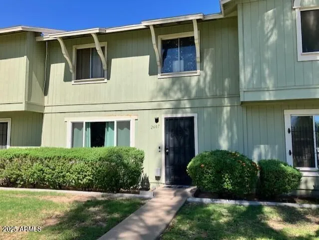 a view of a house with a yard