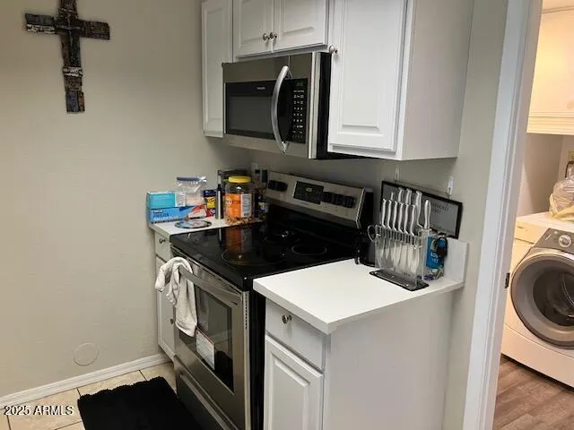 a kitchen with a stove and a microwave