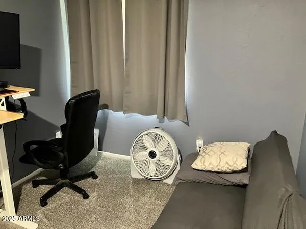 a view of a car garage with furniture