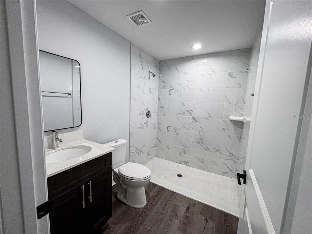 4202 Westminster Road Sebring, FL 33875 - Photo 4 of 8 a bathroom with a sink a toilet and shower