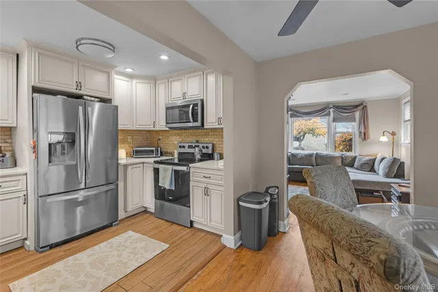 a front view of a house with a yard table and chairs
