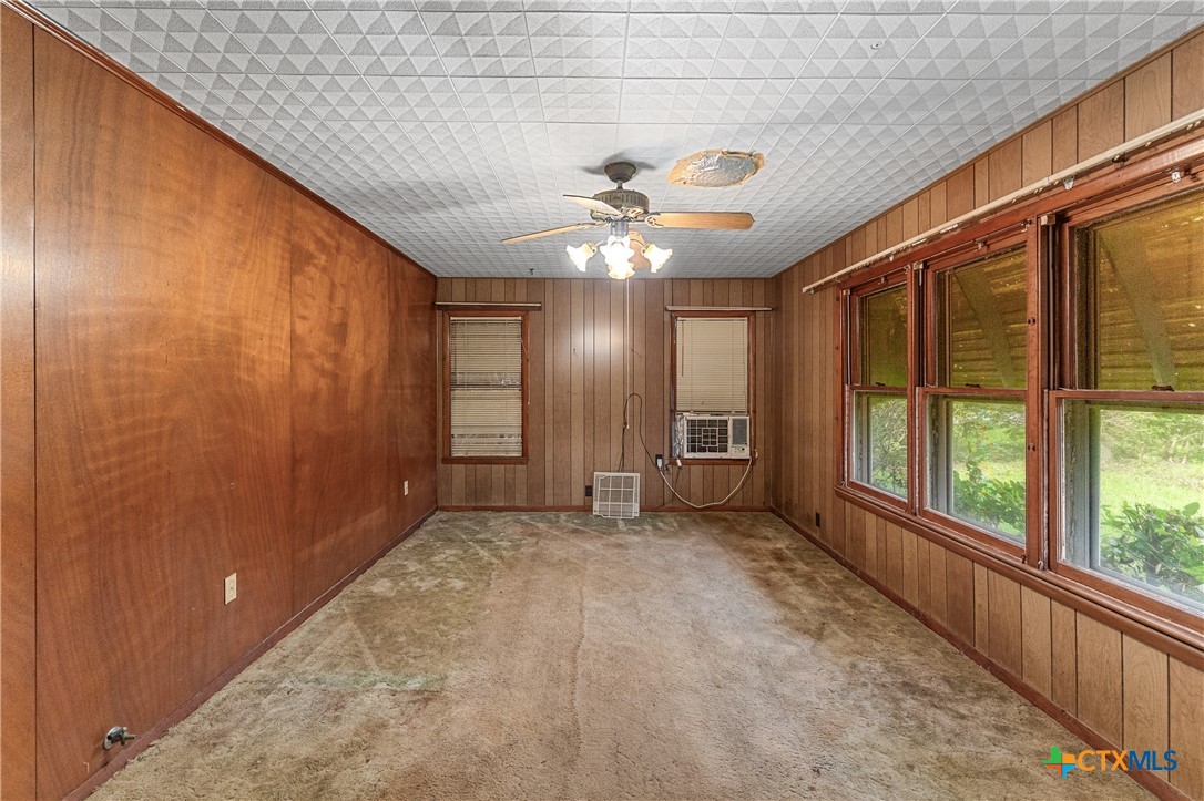 401 Kerr Street Edna, TX 77957 - Photo 7 of 23 a view of a livingroom with a ceiling fan and window