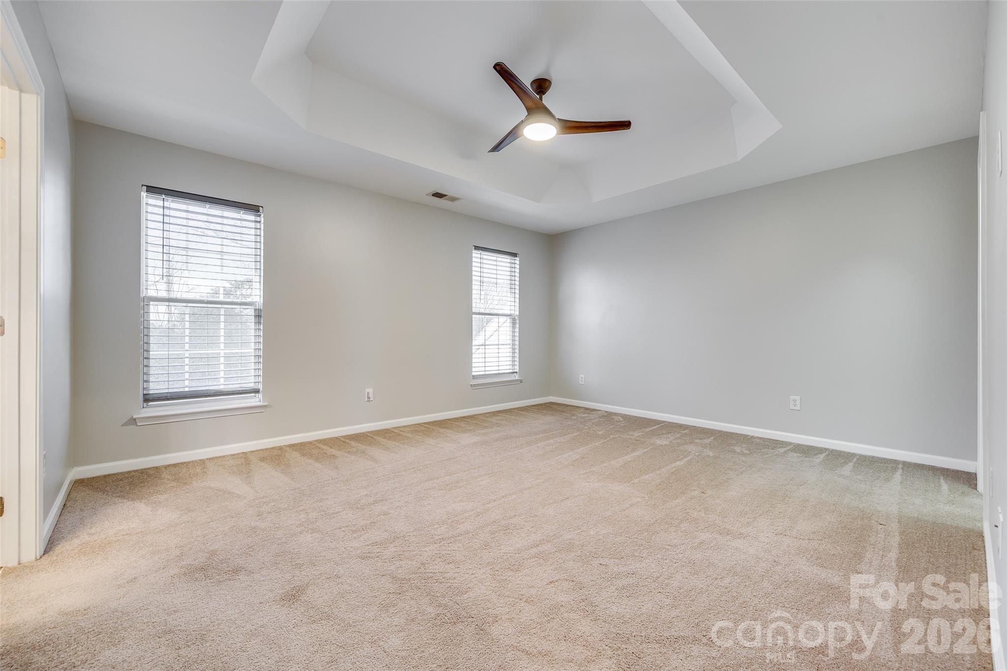618 Bayou Circle Clover, SC 29710 - Photo 28 of 31 an empty room with windows and ceiling fan