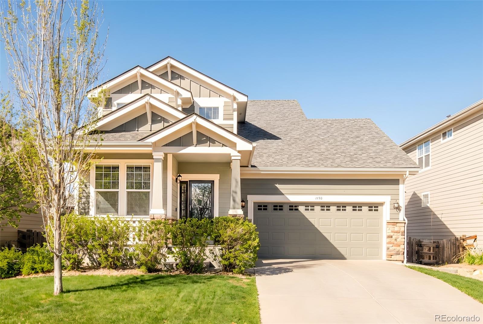 1150 Mircos Street Erie, CO 80516 - Photo 1 of 46 a front view of a house with garden
