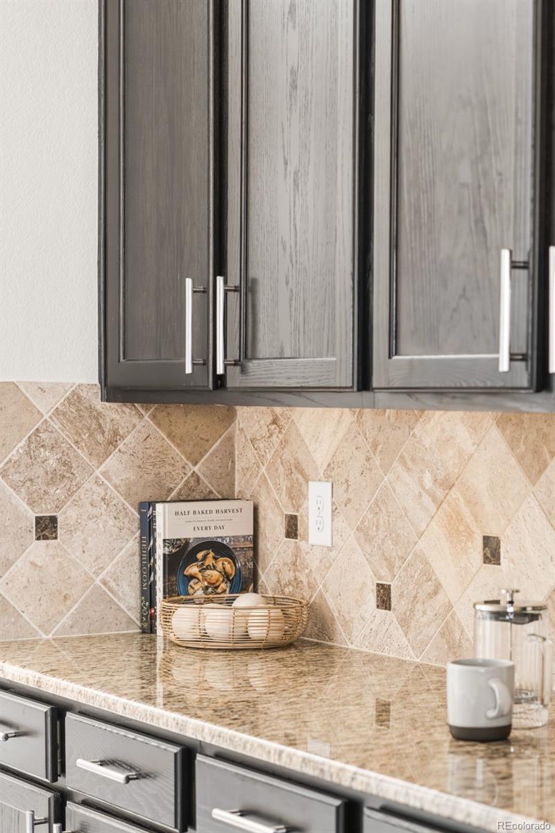 1150 Mircos Street Erie, CO 80516 - Photo 14 of 46 a view of kitchen with granite countertop cabinets
