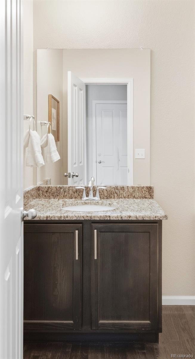 1150 Mircos Street Erie, CO 80516 - Photo 16 of 46 a bathroom with a granite countertop sink and a mirror