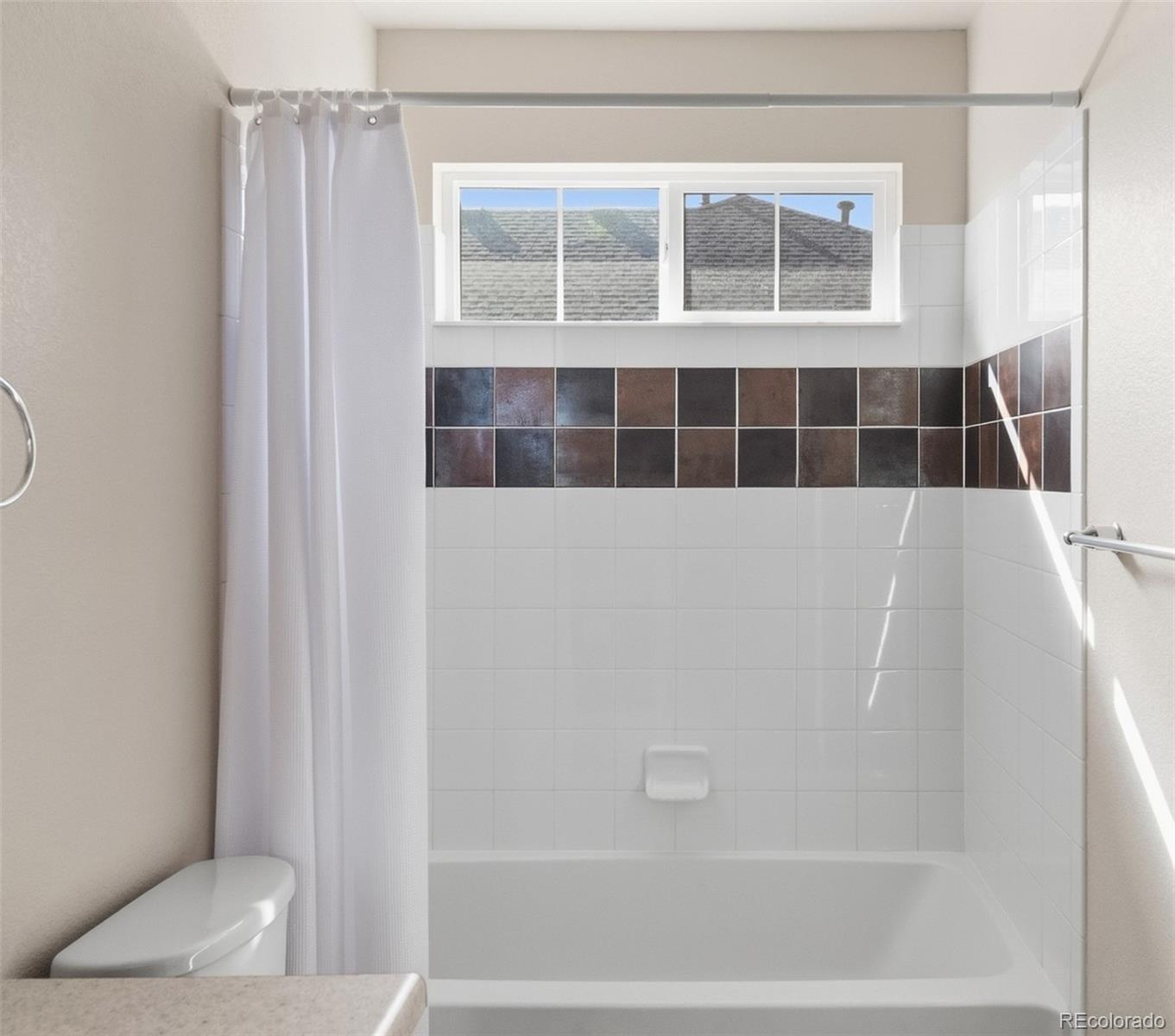 1150 Mircos Street Erie, CO 80516 - Photo 27 of 46 a bathroom with a bathtub