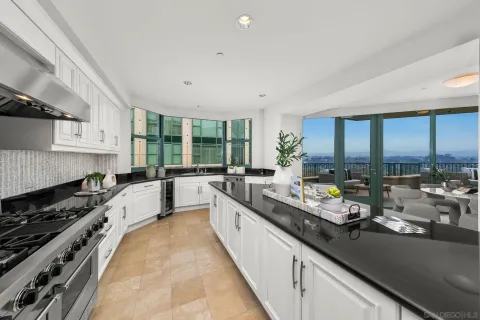 a view of staircase with wooden floor and a potted plant