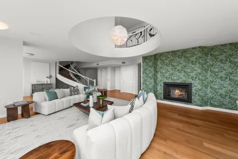 a bedroom with a large bed couch and a window