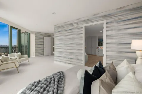 a bathroom with a granite countertop sink a large mirror and a shower