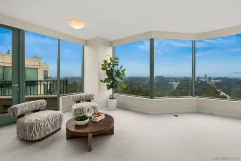 a bedroom with a bed and large mirror