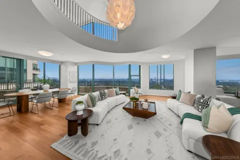 a balcony with furniture and city view