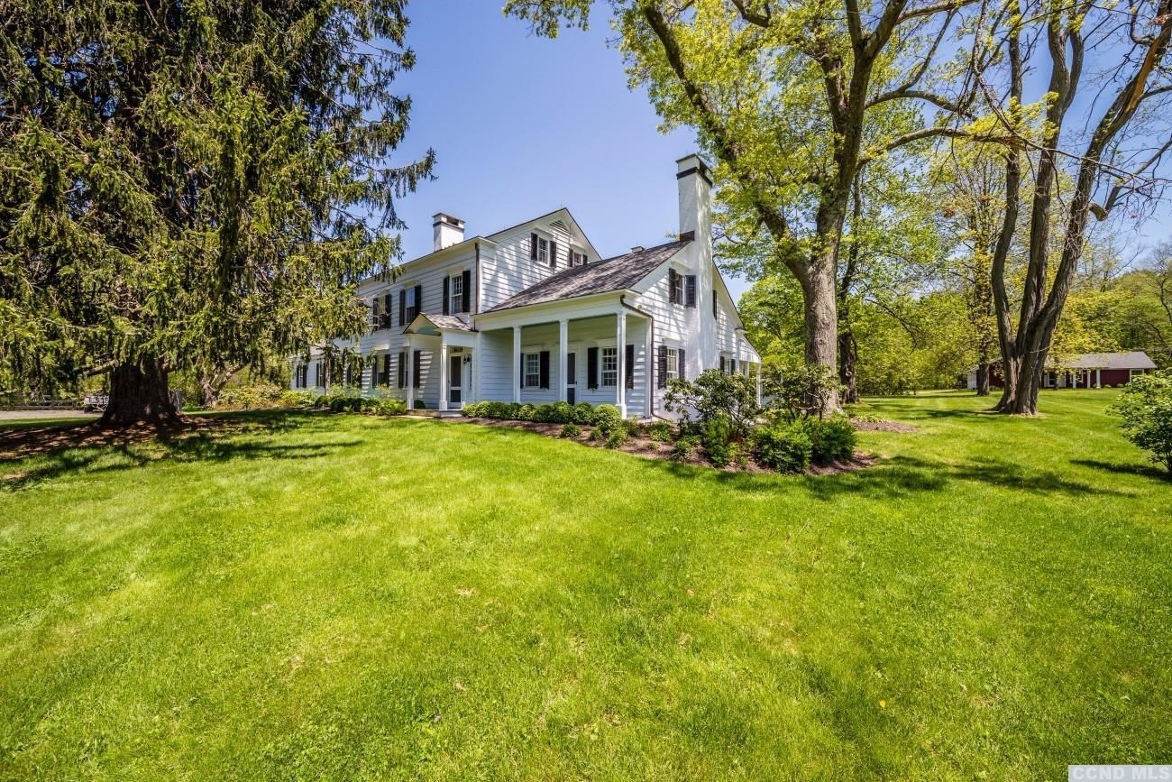 600 Chestnut Ridge Road Dover, NY 12522 - Photo 1 of 10 a front view of a house with a yard table and chairs