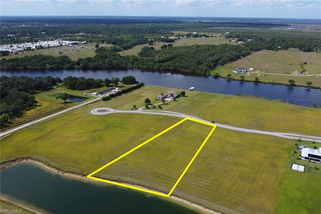 22728 Yellow Button Lane Alva, FL 33920 - Photo 1 of 12 Birds eye view of property with a water view and a rural view