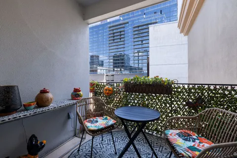 a view of a kitchen with a sink and cabinets