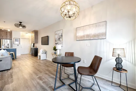a view of a livingroom with furniture and a mirror