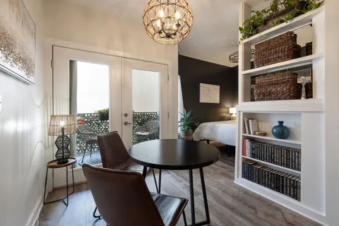 a view of a dining room with furniture window and wooden floor