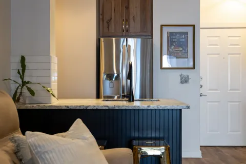 a view of a sink and an entryway