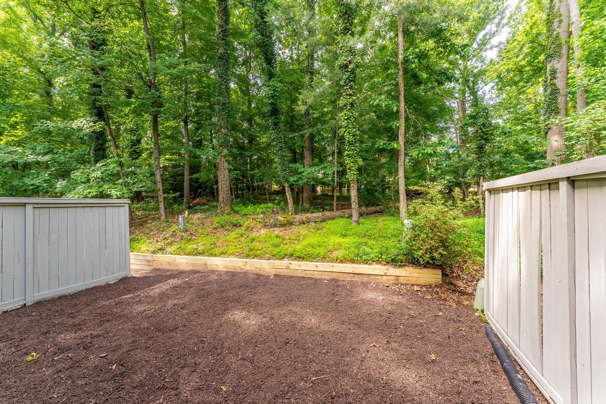 12023 Insha Court Reston, VA 20191 - Photo 52 of 52 a view of a house with backyard and a tree