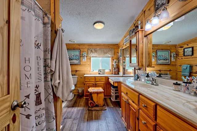 a bathroom with a sink and a large mirror