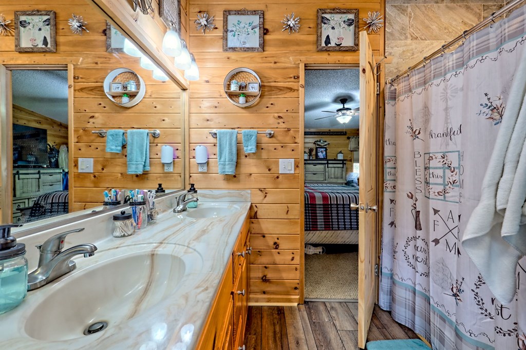 1483 Hilltop Road Murphy, NC 28906 - Photo 20 of 74 a bathroom with a sink and a large mirror
