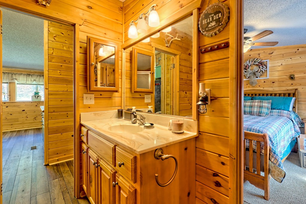 1483 Hilltop Road Murphy, NC 28906 - Photo 25 of 74 a bathroom with a sink and a mirror