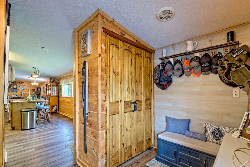 1483 Hilltop Road Murphy, NC 28906 - Photo 41 of 74 a living room with stainless steel appliances furniture and a wooden floor