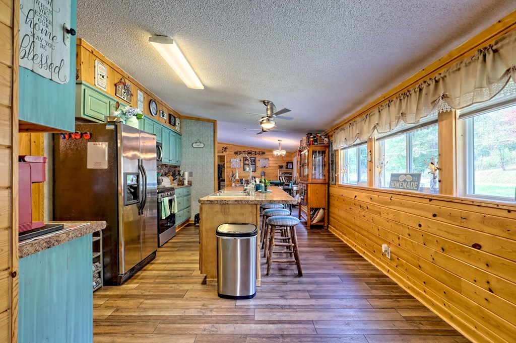 1483 Hilltop Road Murphy, NC 28906 - Photo 42 of 74 a view of a dining room with furniture window and wooden floor