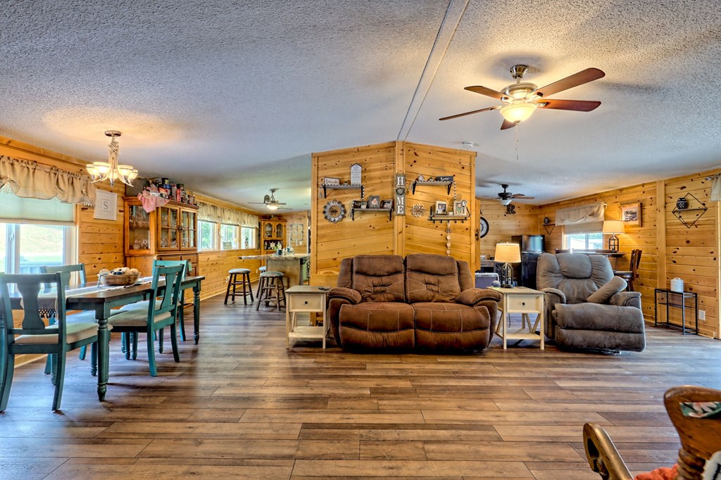 1483 Hilltop Road Murphy, NC 28906 - Photo 49 of 74 a living room with fireplace furniture and a large window