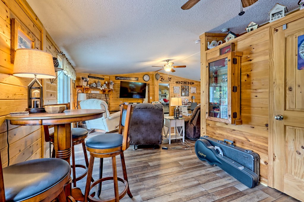 1483 Hilltop Road Murphy, NC 28906 - Photo 50 of 74 a view of a dining room with furniture and wooden floor
