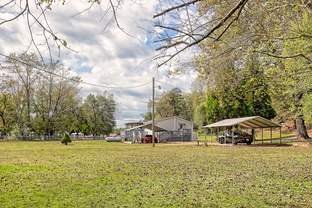 1483 Hilltop Road Murphy, NC 28906 - Photo 56 of 74 a view of a house with backyard and trees