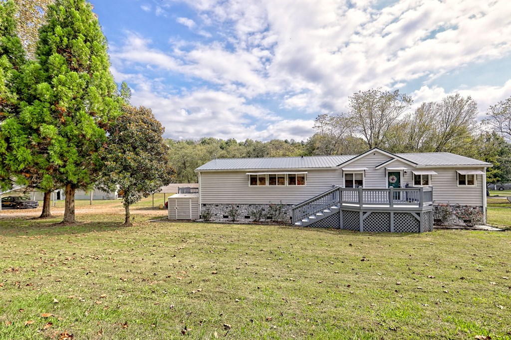 1483 Hilltop Road Murphy, NC 28906 - Photo 6 of 74 a house that has a tree in front of it