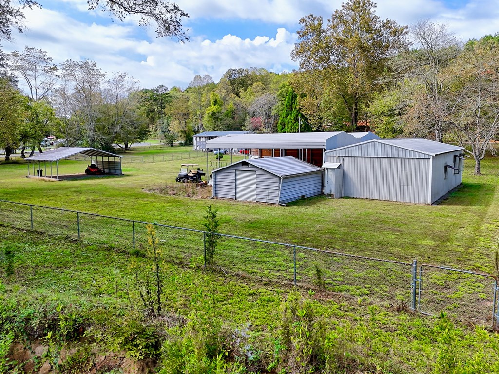 1483 Hilltop Road Murphy, NC 28906 - Photo 69 of 74 a view of a house with a garden and trees