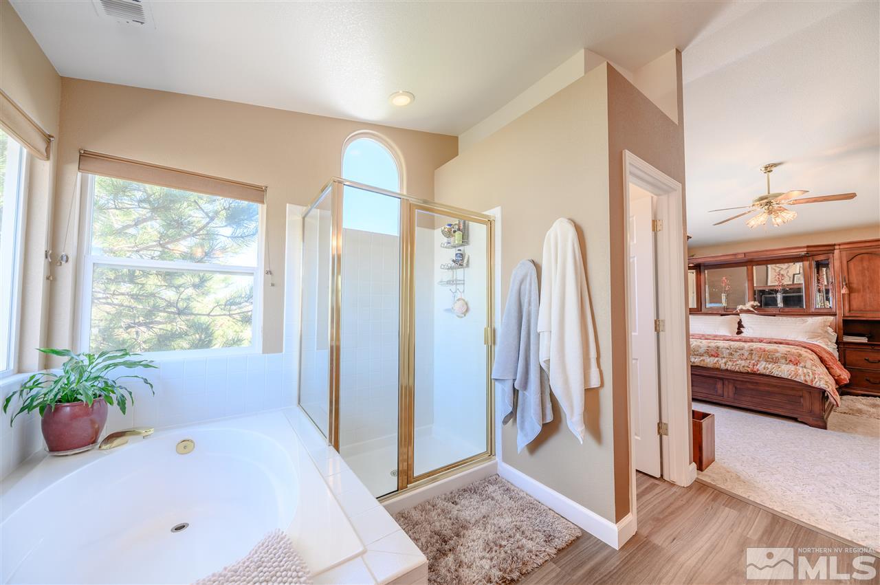 14225 Ghost Rider Drive Reno, NV 89511 - Photo 13 of 24 a bathroom with a tub and shower